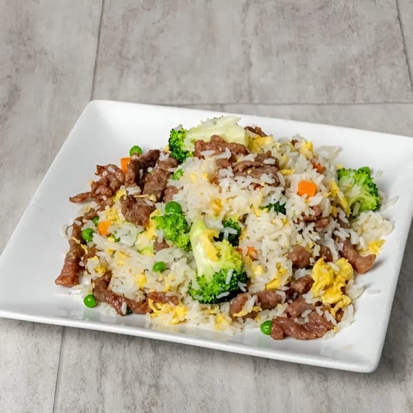 Golden China Restaurant's beef fried rice with broccoli, peas, carrots, and scrambled egg.