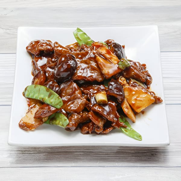 Golden China Restaurant's beef with mushrooms and snow peas in a rich brown sauce.