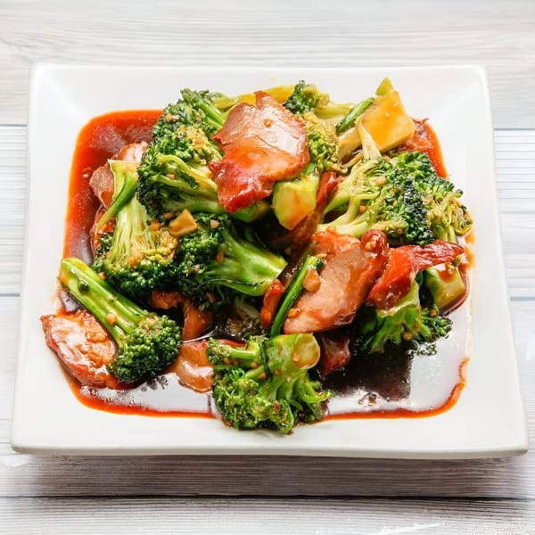 Golden China Restaurant's Chinese dish with broccoli and meat in a rich red sauce.