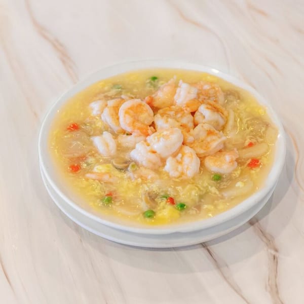 Golden China Restaurant's shrimp with lobster sauce, featuring plump shrimp, peas, and red peppers.